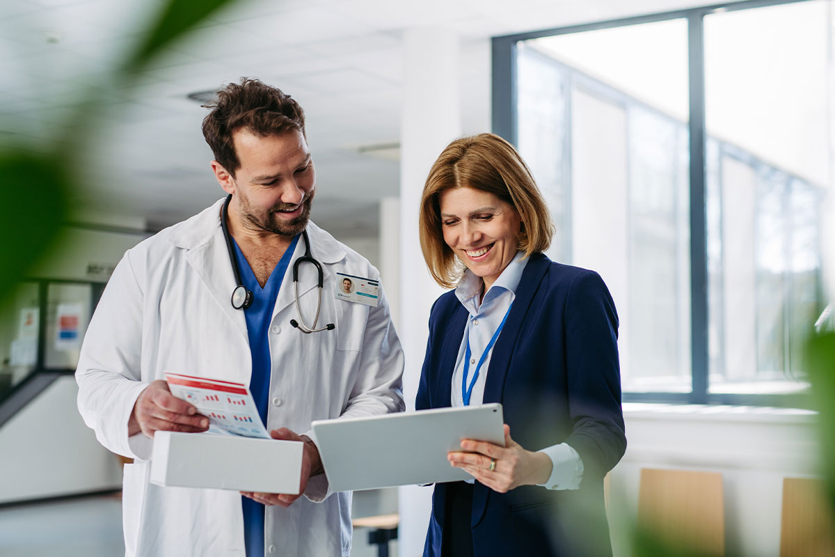 two doctors looking at tablet in a hospital